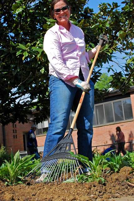 Woman at rain garden planting Woman at rain garden planting
